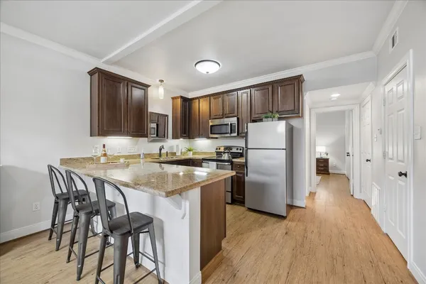 a sign board with palm trees