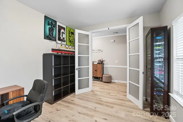 a bedroom with a bed and a bookshelf