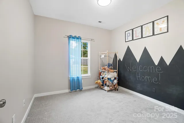 a view of game room with windows