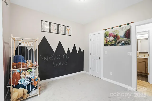 a view of a hallway with a bedroom