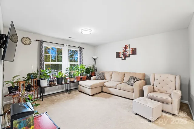 a living room with furniture and windows