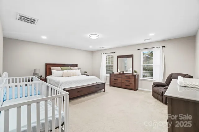 a bedroom with furniture and a window