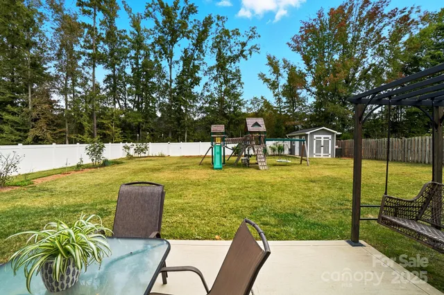 a view of a swimming pool with a lounge chair