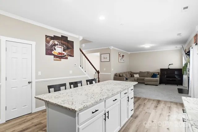 a kitchen with a stove and a refrigerator