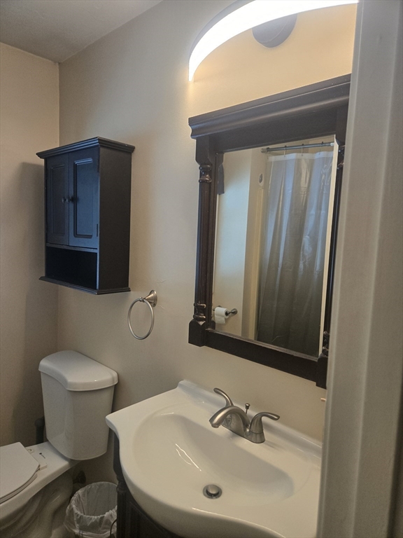 406 Lebanon Hill Road Southbridge, MA 01550 - Photo 12 of 36 a bathroom with a toilet sink and mirror