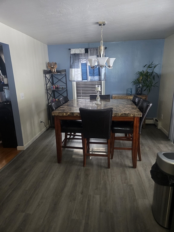 406 Lebanon Hill Road Southbridge, MA 01550 - Photo 13 of 36 a view of a dining room with furniture and wooden floor