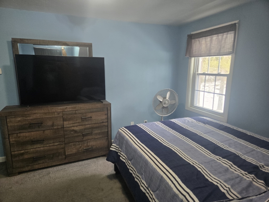 406 Lebanon Hill Road Southbridge, MA 01550 - Photo 22 of 36 a living room with furniture and a flat screen tv
