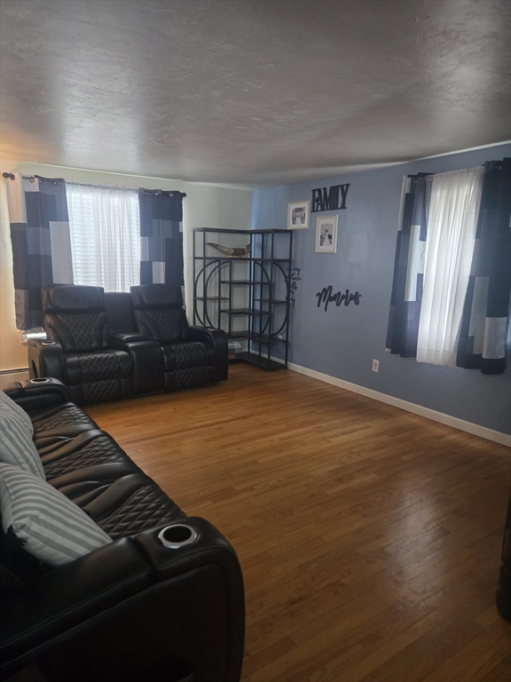 406 Lebanon Hill Road Southbridge, MA 01550 - Photo 29 of 36 a bedroom with a bed and wooden floor