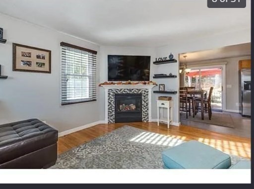 406 Lebanon Hill Road Southbridge, MA 01550 - Photo 7 of 36 a living room with furniture a flat screen tv and a fireplace
