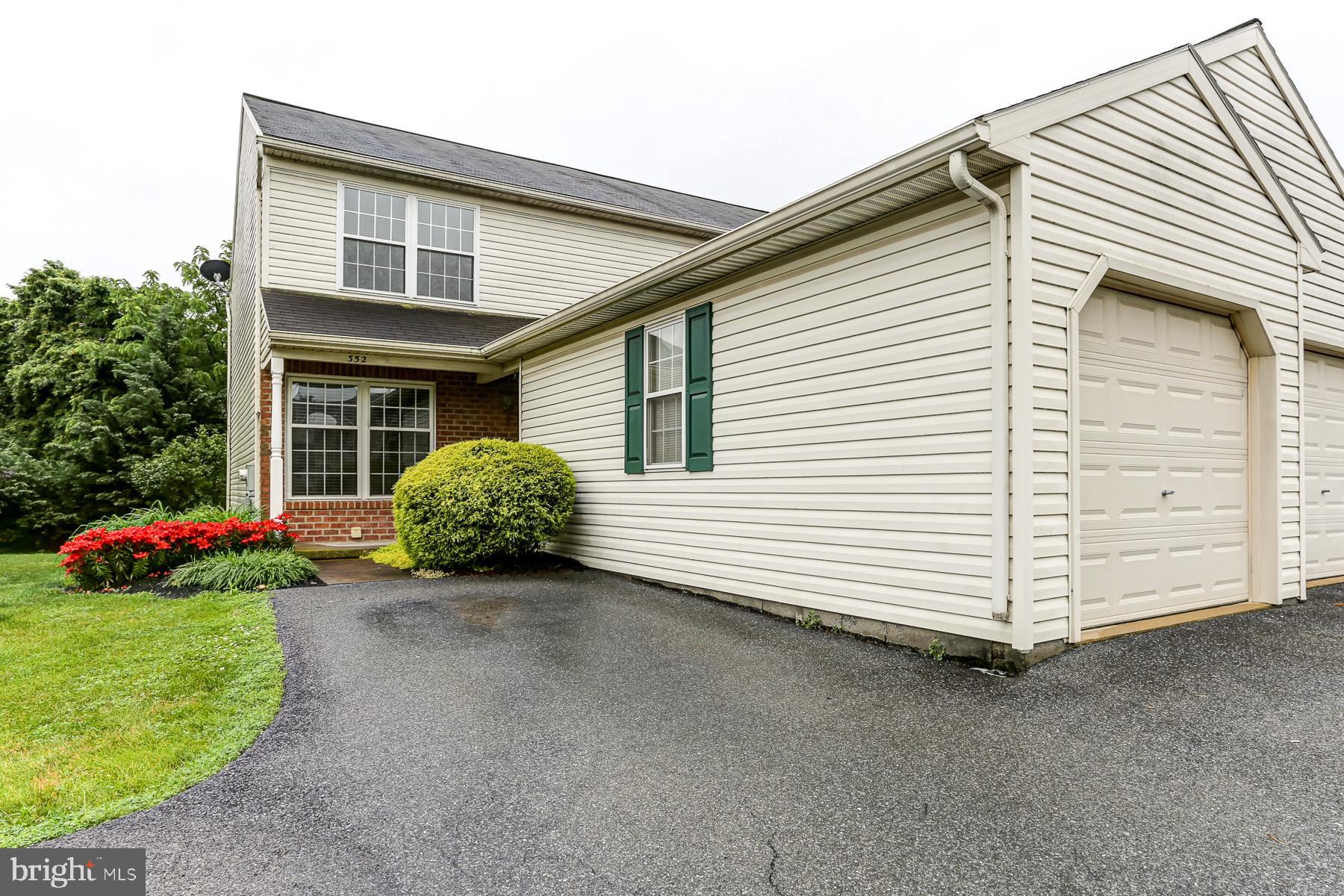 352 Deerfield Drive Mount Joy, PA 17552 - Photo 2 of 21 a front view of a house with a yard