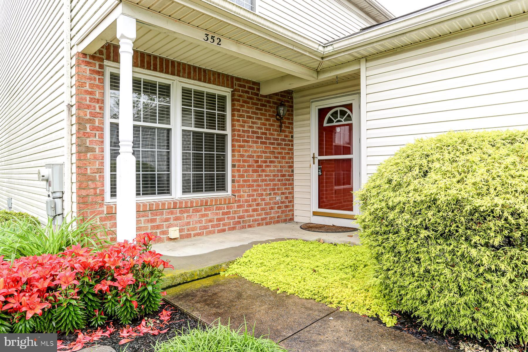 352 Deerfield Drive Mount Joy, PA 17552 - Photo 3 of 21 a front view of a house with a garden