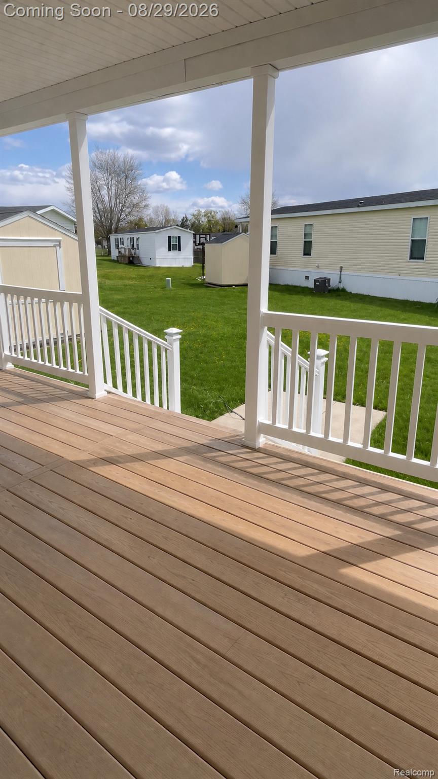 46000 Geddes Road, Unit 520 Canton, MI 48188 - Photo 28 of 29 Covered porch with wood-finish decking and white railings