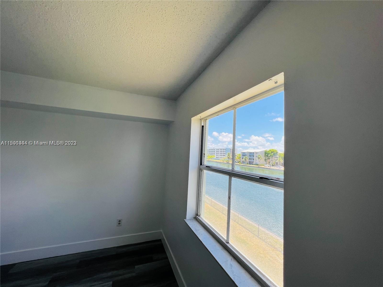 8260 Southwest 210th Street, Unit 220 Cutler Bay, FL 33189 - Photo 11 of 21 a view of an empty room and window