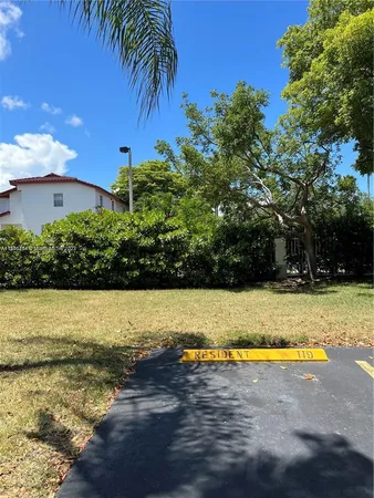 a view of a swimming pool with an outdoor space and seating area
