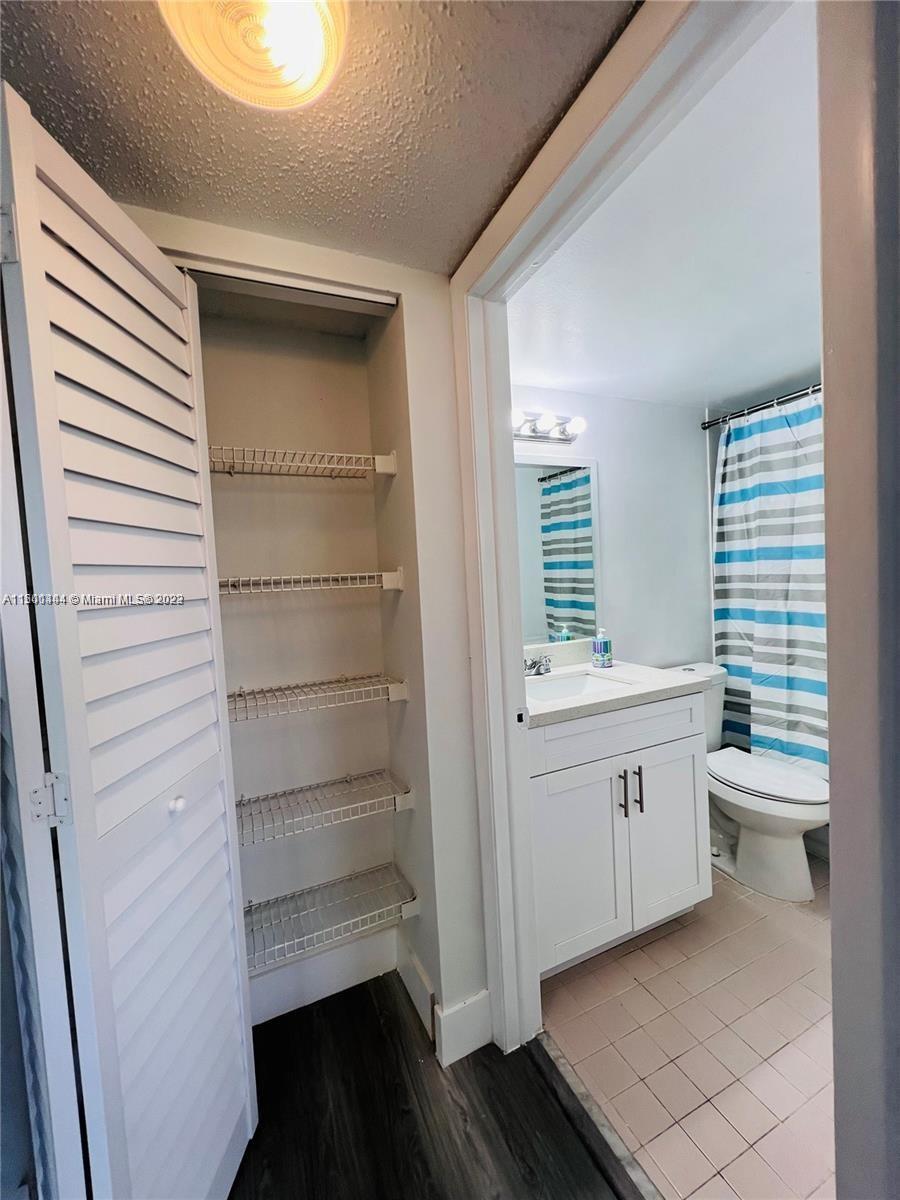 8260 Southwest 210th Street, Unit 220 Cutler Bay, FL 33189 - Photo 10 of 21 a room with storage and utility
