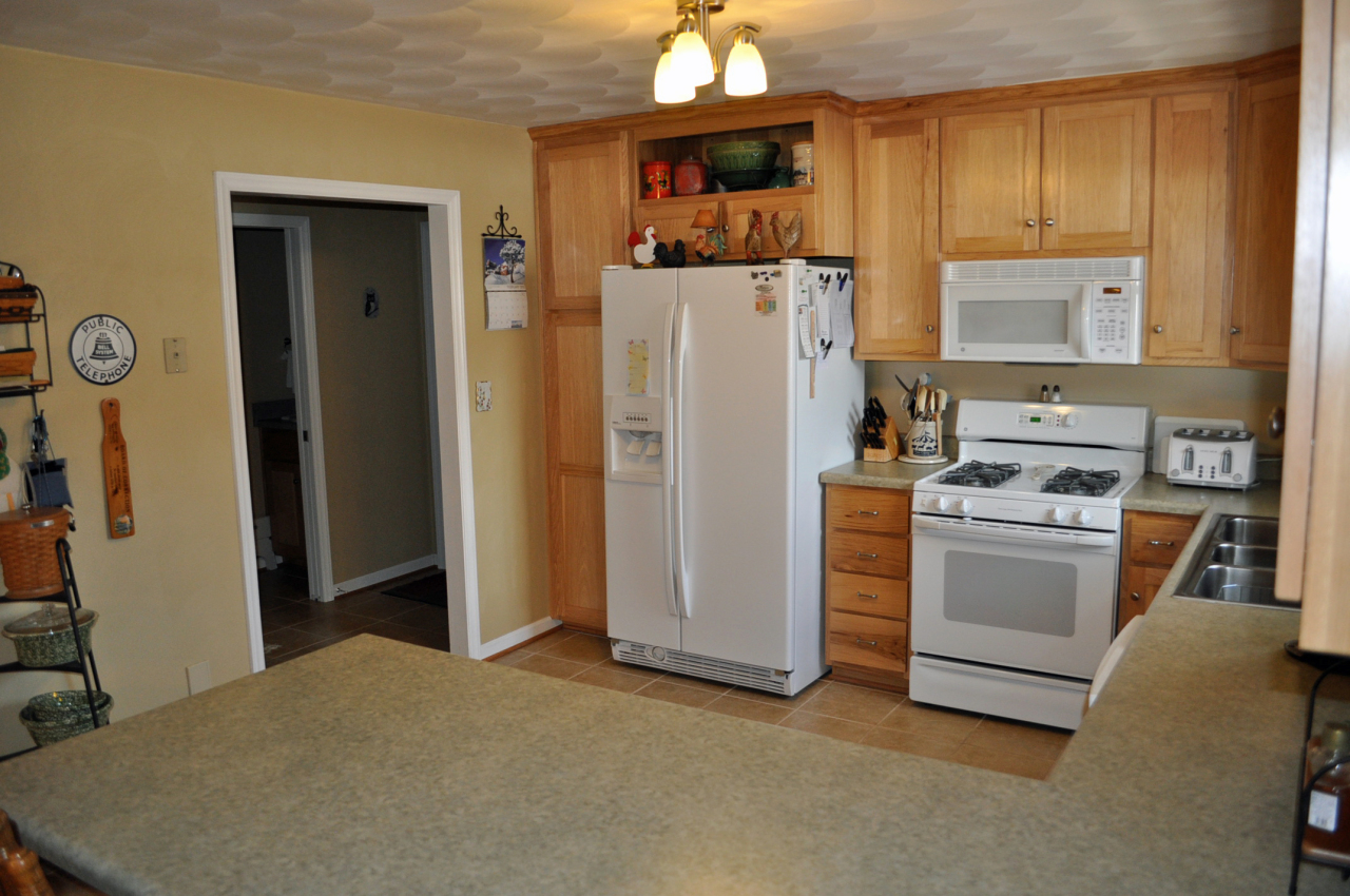 110 Mallard Point Road Wirtz, VA 24184 - Photo 11 of 34 a kitchen with stainless steel appliances a refrigerator stove and sink