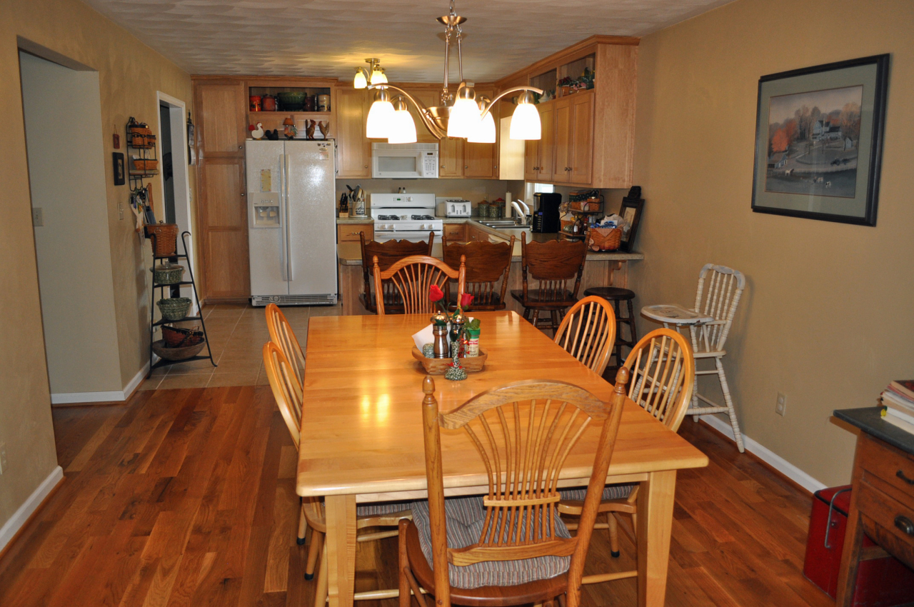 110 Mallard Point Road Wirtz, VA 24184 - Photo 12 of 34 a view of a dining room with furniture window and wooden floor