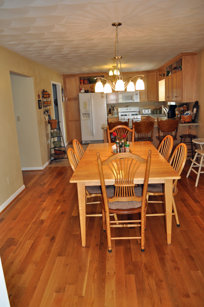110 Mallard Point Road Wirtz, VA 24184 - Photo 13 of 34 a dining room with furniture a chandelier and wooden floor