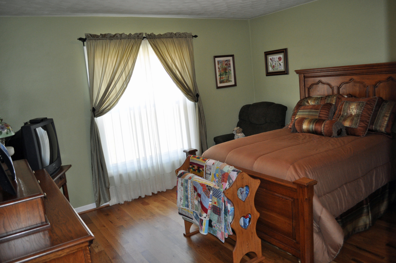 110 Mallard Point Road Wirtz, VA 24184 - Photo 19 of 34 a bedroom with a bed next to a window
