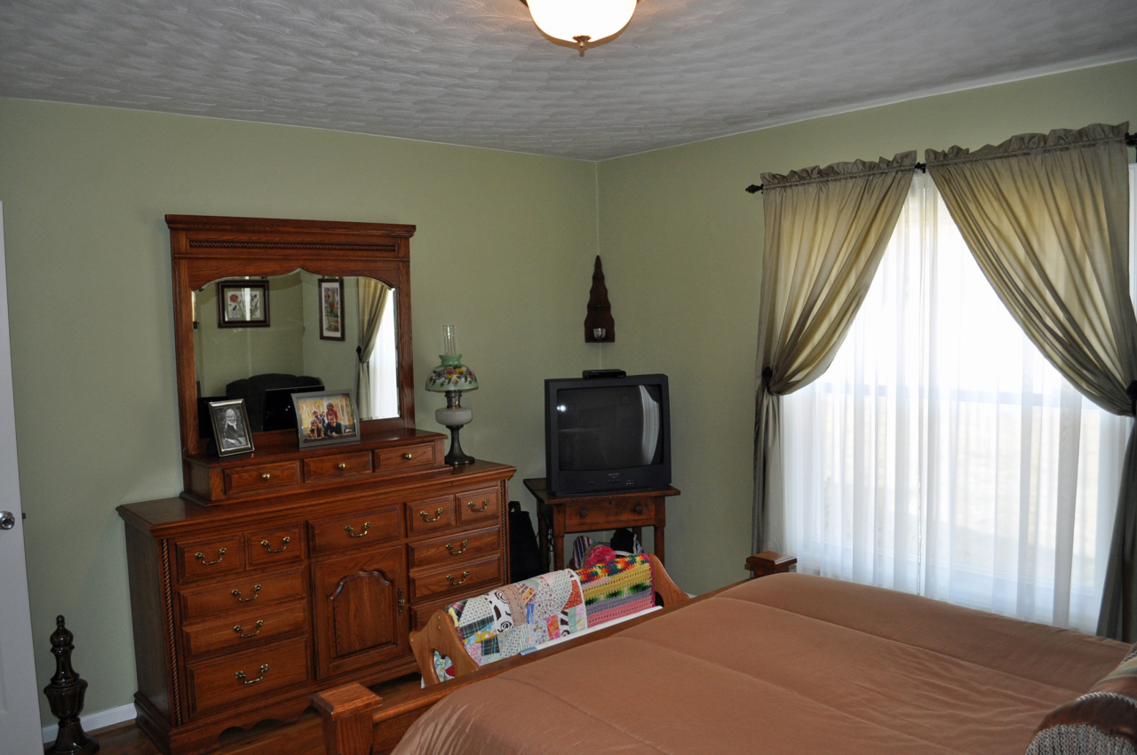 110 Mallard Point Road Wirtz, VA 24184 - Photo 20 of 34 a bedroom with a bed and furniture