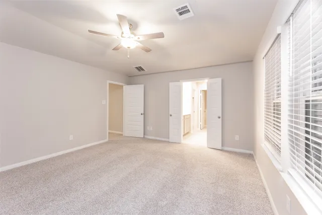 a bathroom with a double vanity sink shower and a mirror