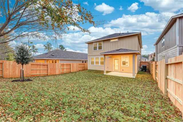a backyard of a house with lots of green space