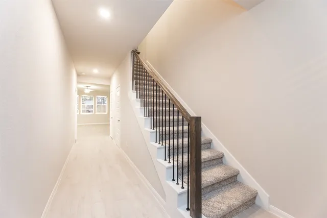 a view of a hallway with staircase
