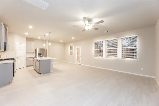 a view of a kitchen with a sink and a window