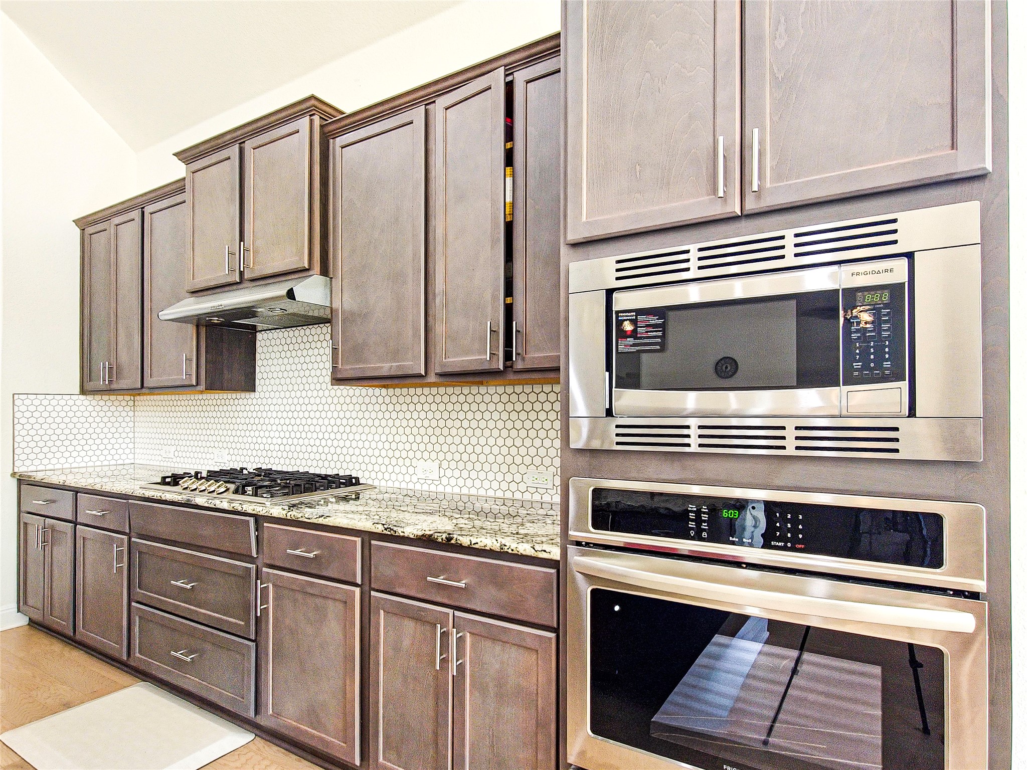 813 Sunny Ridge Drive Leander, TX 78641 - Photo 12 of 32 Culinary delights await in this chef's kitchen, featuring modern appliances and elegant finishes.