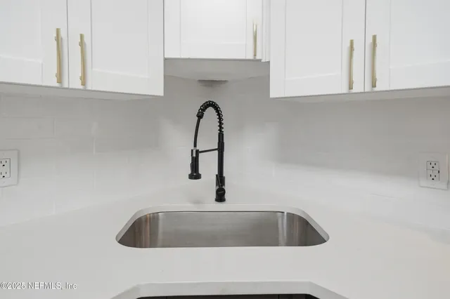 a kitchen with a refrigerator and a window
