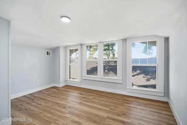 a bathroom with a sink a vanity and a window