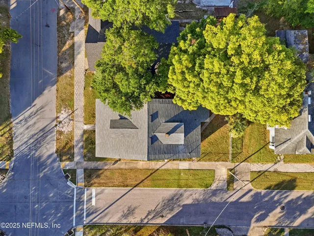 an aerial view of residential houses with outdoor space