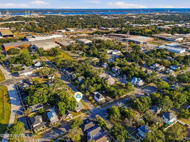 an aerial view of residential houses with outdoor space