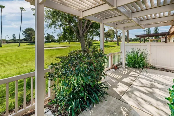 a view of a swimming pool with a yard