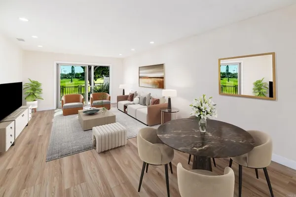 a living room with furniture and a table