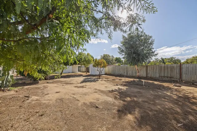 a backyard of a house with lots of green space