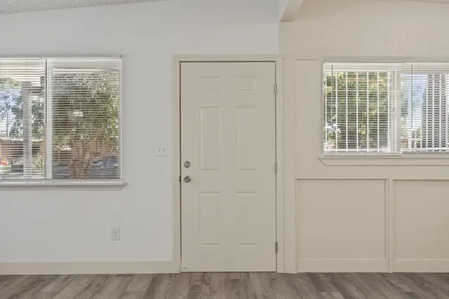 a view of an empty room with a window