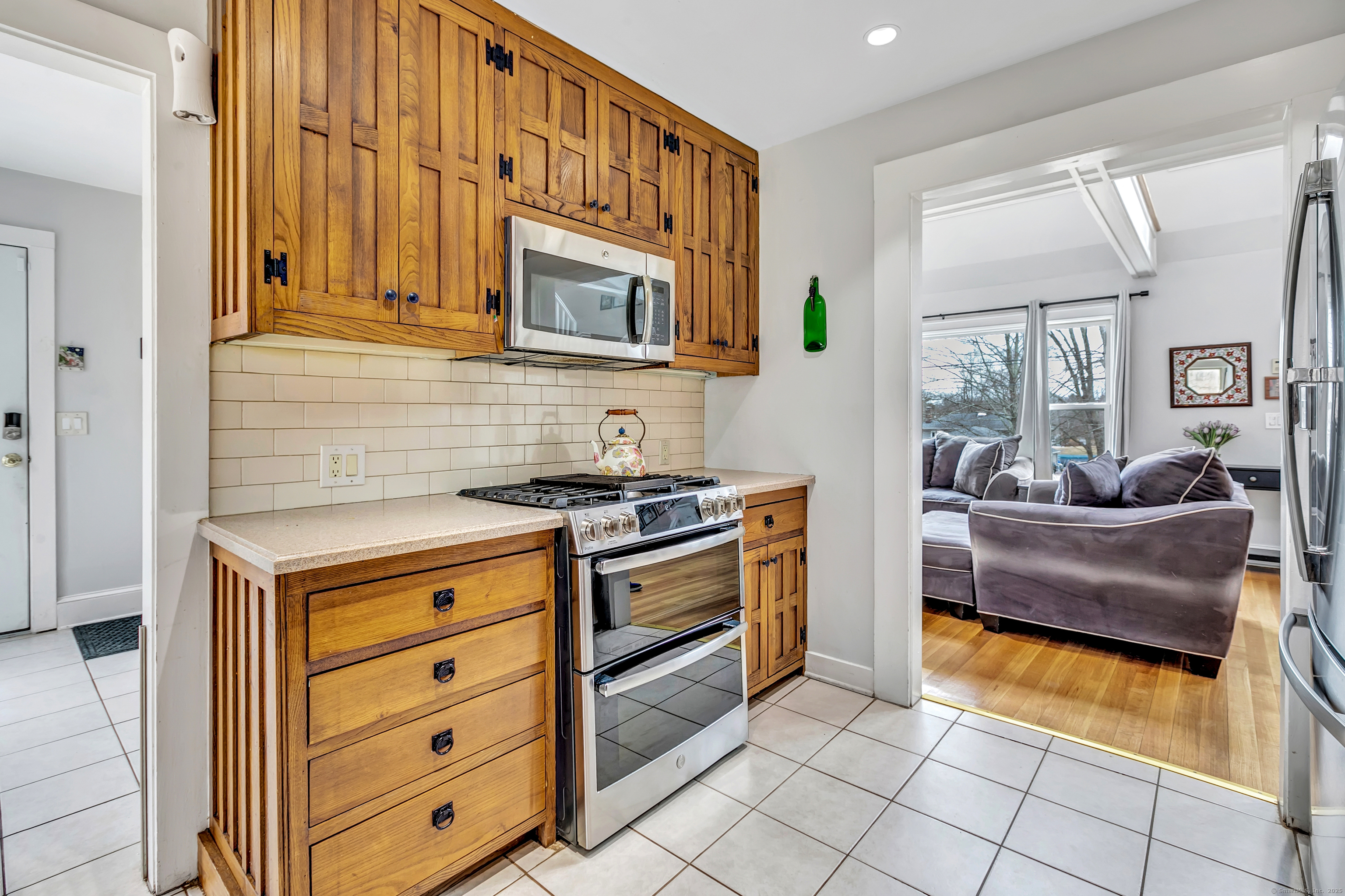 41 Mohawk Drive Norwalk, CT 06851 - Photo 11 of 31 a kitchen with stainless steel appliances granite countertop a stove and a sink