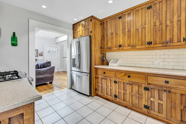 a kitchen with stainless steel appliances a refrigerator and a stove