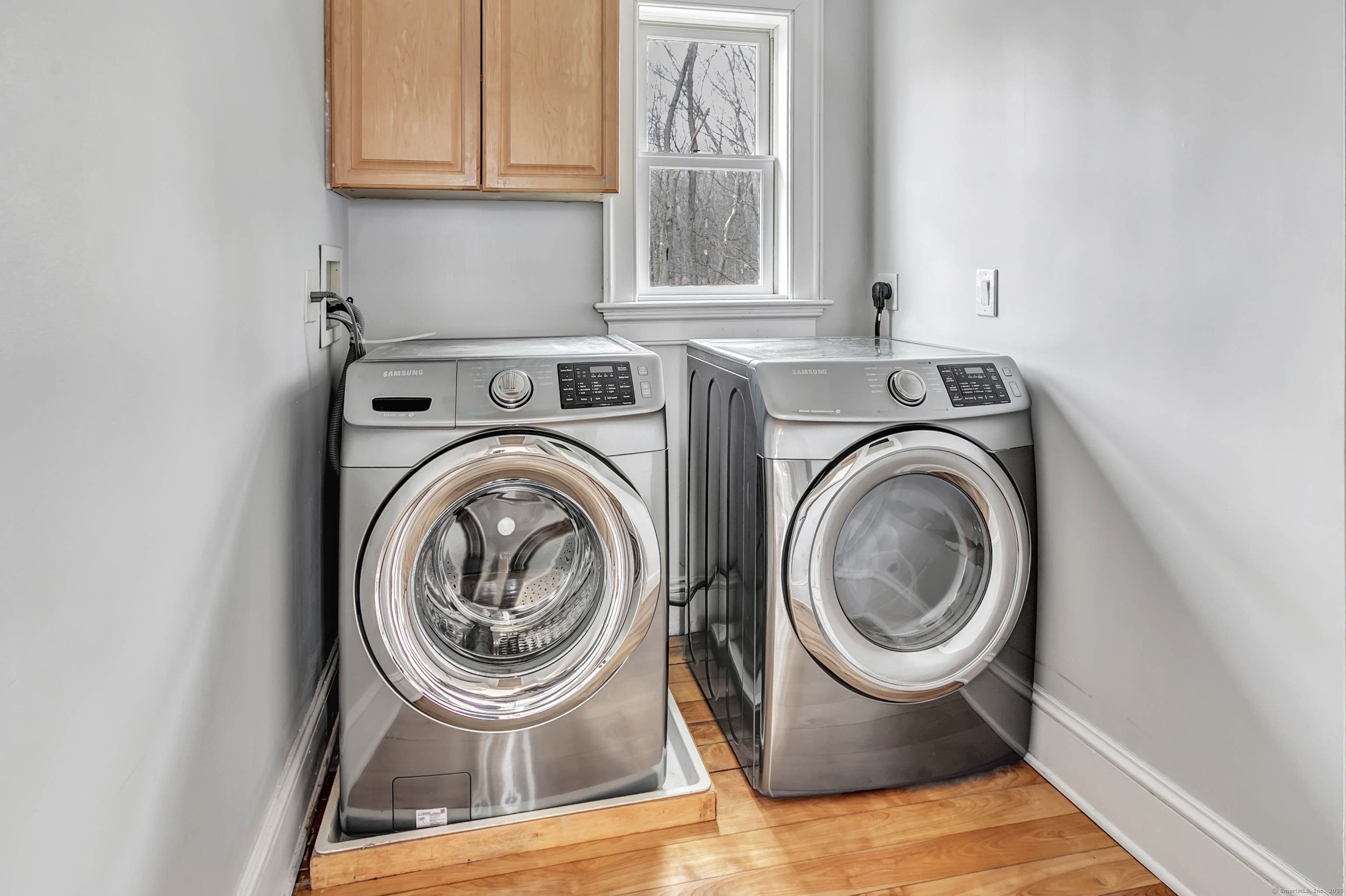 41 Mohawk Drive Norwalk, CT 06851 - Photo 28 of 31 a view of a bedroom with washer and dryer