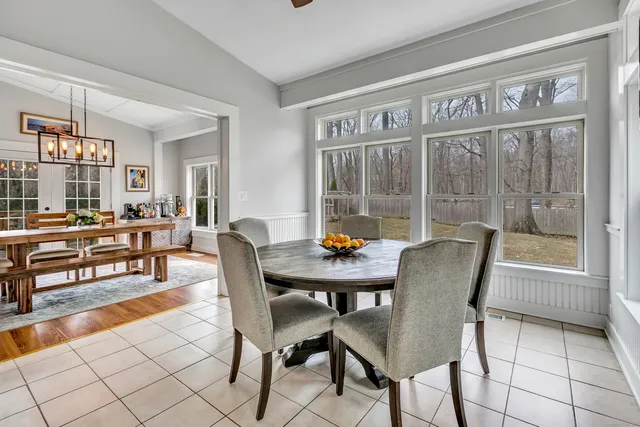 a dining room with furniture and window
