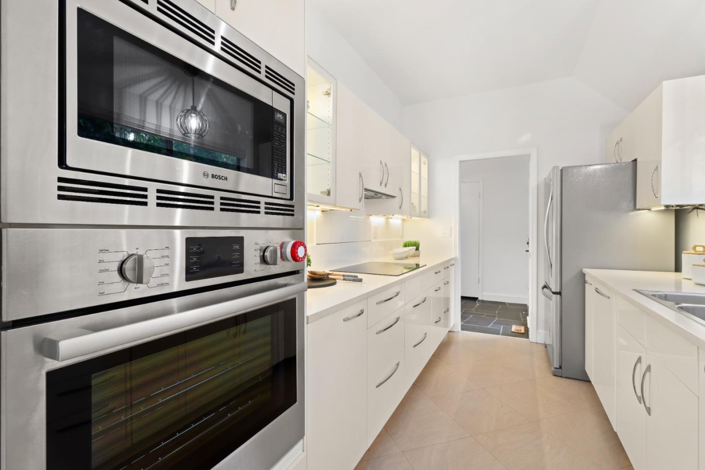 28 Farm Road Los Altos, CA 94024 - Photo 11 of 28 a kitchen with stainless steel appliances a stove microwave and cabinets