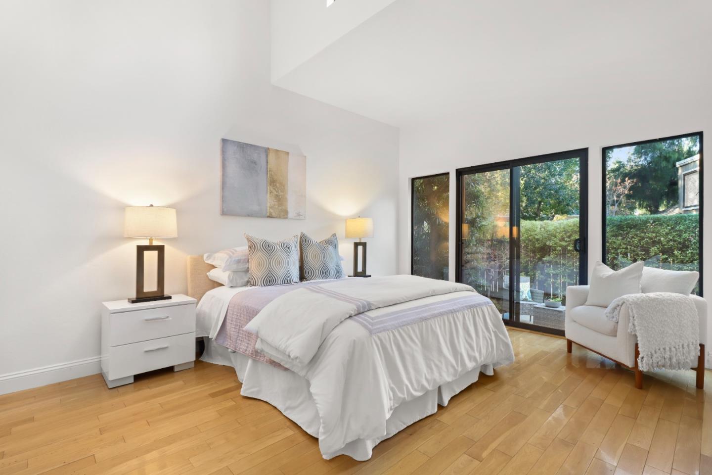 28 Farm Road Los Altos, CA 94024 - Photo 16 of 28 a bedroom with a bed lamp and a large window with outer view