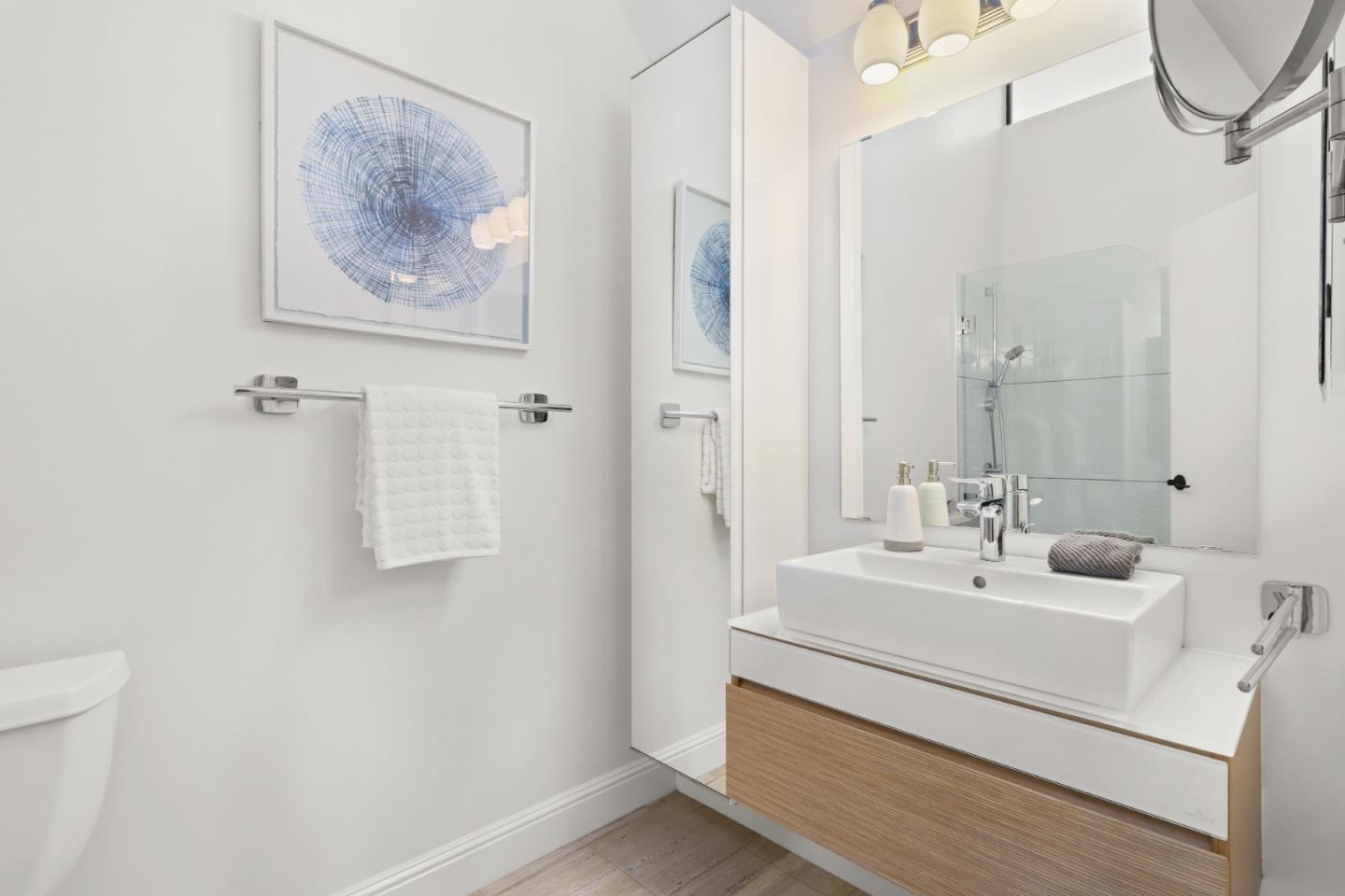 28 Farm Road Los Altos, CA 94024 - Photo 18 of 28 a bathroom with a sink a mirror and a shower