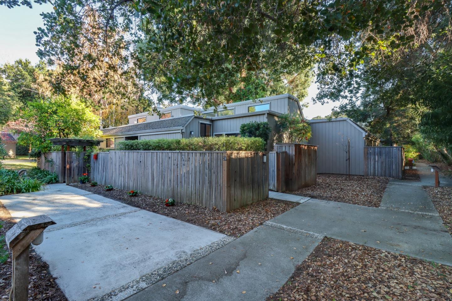 28 Farm Road Los Altos, CA 94024 - Photo 27 of 28 a backyard of a house with a tree and wooden fence