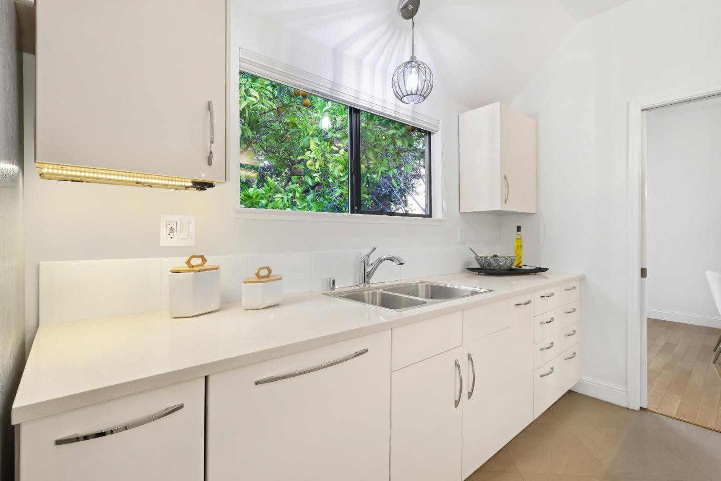 28 Farm Road Los Altos, CA 94024 - Photo 10 of 28 a kitchen with stainless steel appliances white cabinets a window and a sink