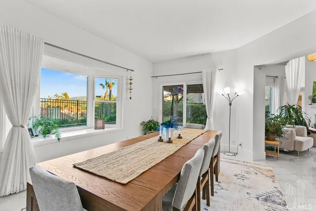a room with furniture and a potted plant