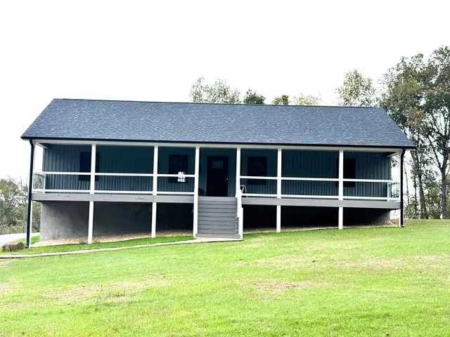 a view of a house with a large window