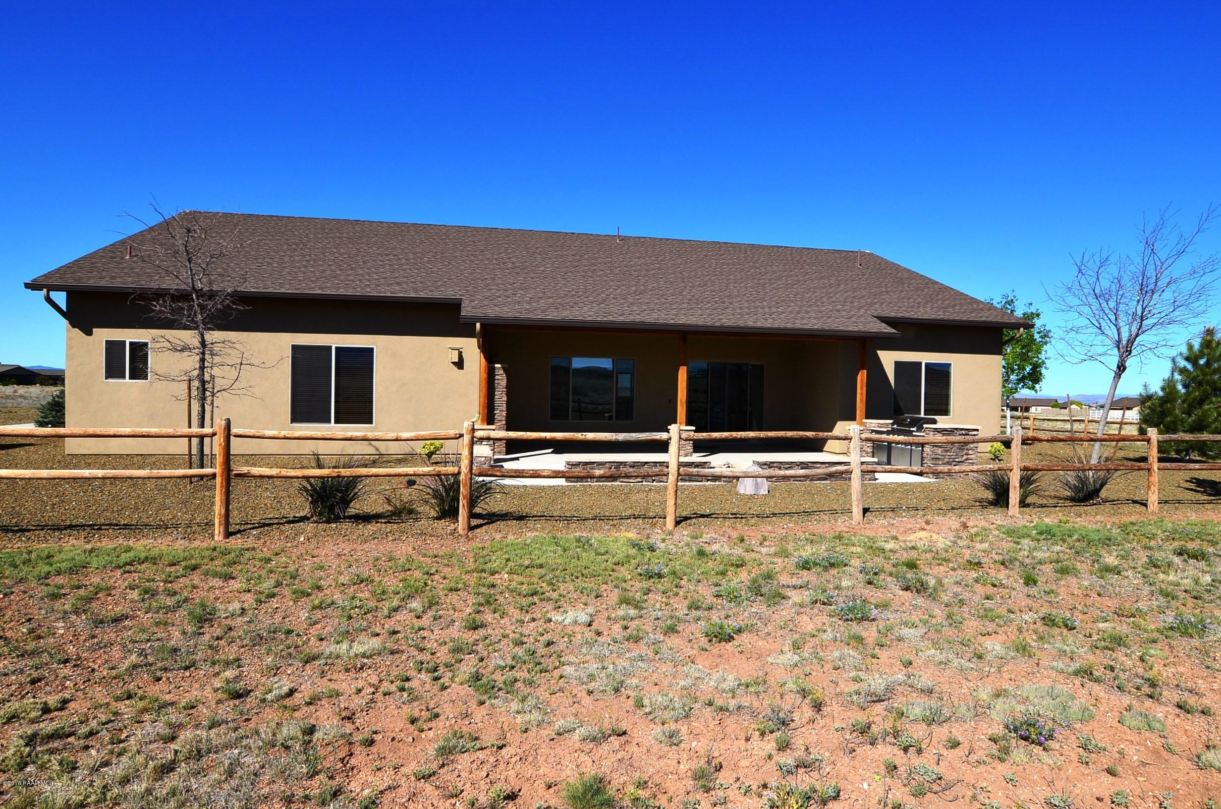 9474 Dows Ranch Road Prescott Valley, AZ 86315 - Photo 17 of 55 a house with trees in the background