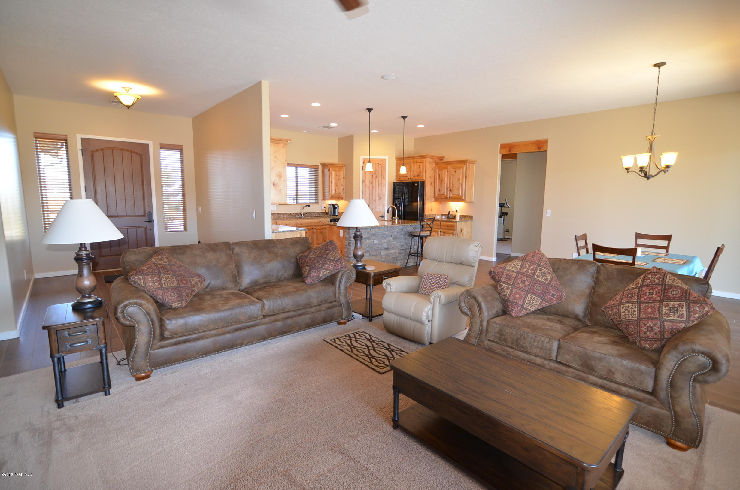 9474 Dows Ranch Road Prescott Valley, AZ 86315 - Photo 2 of 55 a living room with furniture and a chandelier